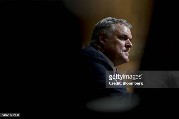 Charles Rettig, commissioner of the Internal Revenue Service nominee for U.S. President Donald Trump, listens during a Senate Finance Committee...