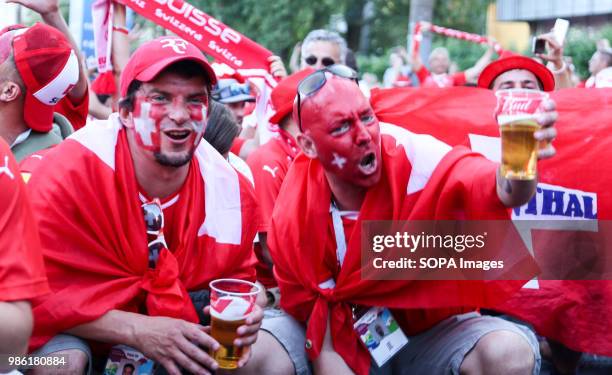 Swiss football fans seen wearing their national flag before the match. They were among hundreds of Swiss football fans who walked the streets in the...