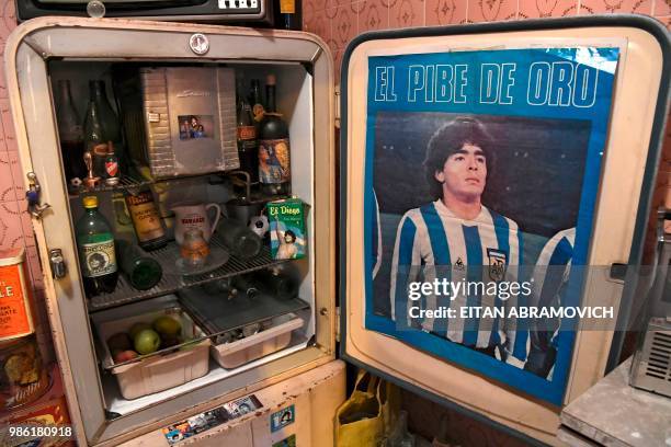 Memorabilia objects are displayed at the 'Casa de Dios' museum in Buenos Aires, on June 27, 2018. - 'Casa de Dios' is located at the house where...