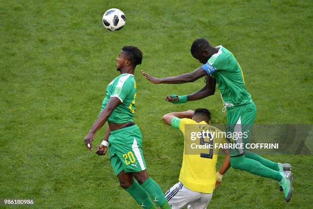 Colombia's forward Falcao vies for the ball with Senegal's forward Keita Balde and Senegal's midfielder Cheikhou Kouyate during the Russia 2018 World...