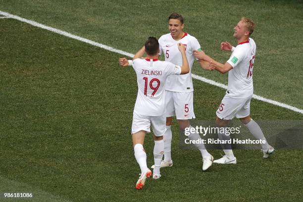 Jan Bednarek of Poland celebrates with teammates Piotr Zielinski and Kamil Glik after scoring his team's first goal during the 2018 FIFA World Cup...