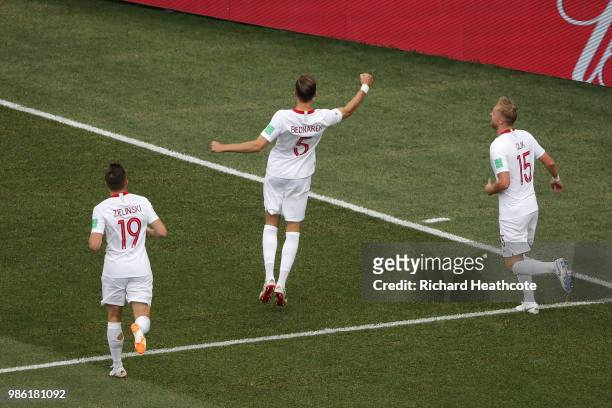 Jan Bednarek of Poland celebrates with teammates Piotr Zielinski and Kamil Glik after scoring his team's first goal during the 2018 FIFA World Cup...