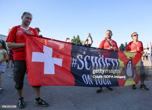 Swiss supporters with a banner. They were among hundreds of Swiss football fans who walked the streets in the city center before the game between...