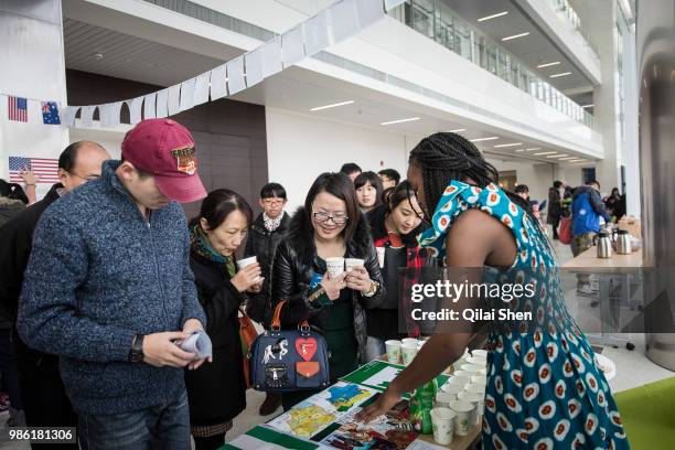 Students and visitors participate in a semester-end international fair at the Duke Kunshan University in Kunshan, Jiangsu Province , China on 07...
