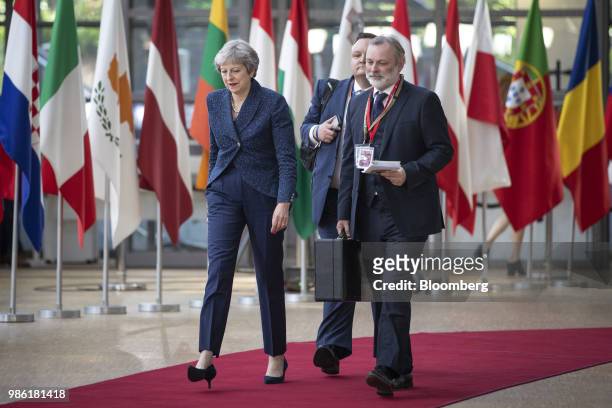 Theresa May, U.K. Prime minister, left, and Tim Barrow, U.K. Permanent representative to the European Union , right, arrive for a European Union...