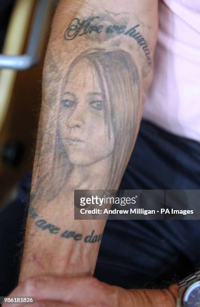 Tattoo of murdered Michelle Stewart seen on the arm of her father Kenny Stewart, during a press conference at the Scottish Parliament in Edinburgh....