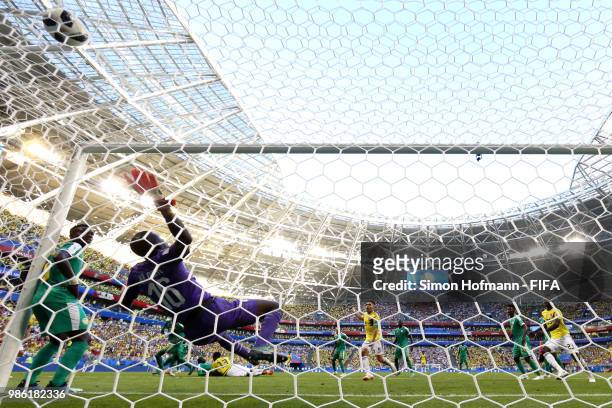 Yerry Mina of Colombia scores his team's first goal past Khadim Ndiaye of Senegal during the 2018 FIFA World Cup Russia group H match between Senegal...
