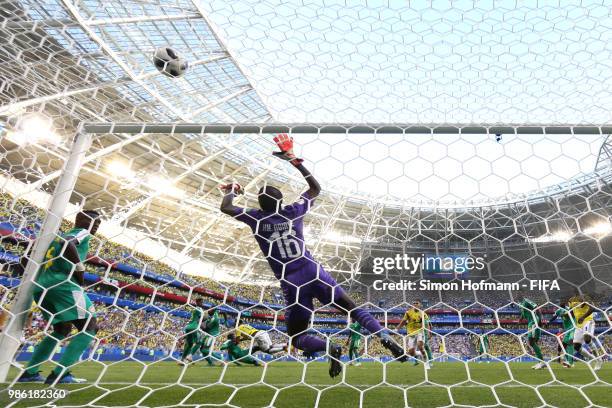 Yerry Mina of Colombia scores his team's first goal past Khadim Ndiaye of Senegal during the 2018 FIFA World Cup Russia group H match between Senegal...