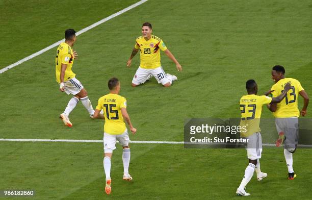 Yerry Mina of Colombia celebrates with teammates after scoring his team's first goal during the 2018 FIFA World Cup Russia group H match between...