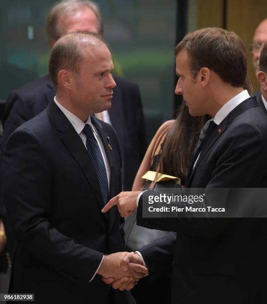 Joseph Muscat, Prime Minister of Malta speaks with Emmanuel Macron, President of France during the EU Council Meeting at European Parliament on June...