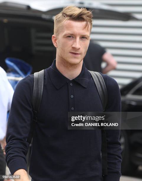 Germany's forward Marco Reus arrives at Frankfurt international airport on June 28 after flying back from Moscow following the German national...