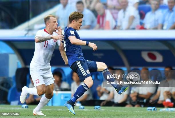 Kamil Grosicki of Poland competes with Gotoku Sakai of Japan during the 2018 FIFA World Cup Russia group H match between Japan and Poland at...