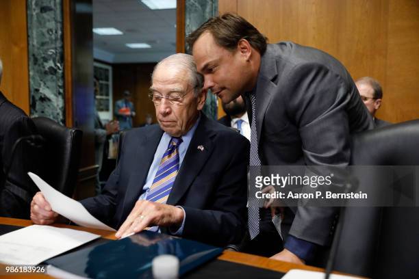 Sen. Chuck Schumer confers with an aide prior to a hearing for Charles Rettig, U.S. President Donald Trump's nominee to be Commissioner of the...
