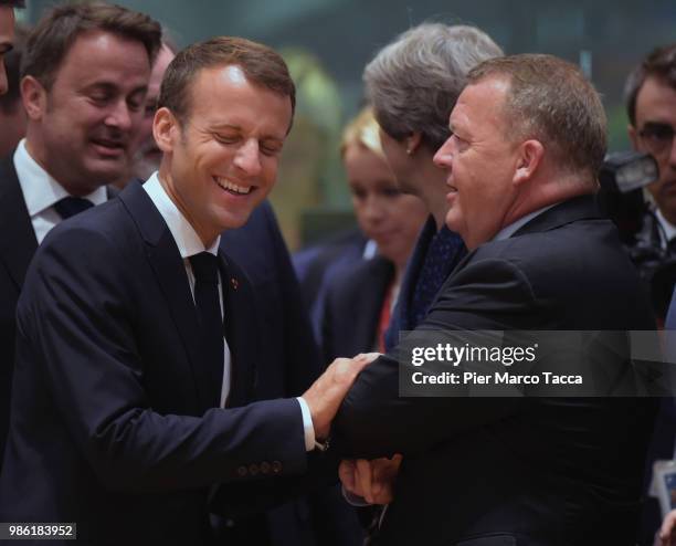 France's President Emmanuel Macron speaks with Lars Lokke Rasmussen, Prime Minister of Denmark during the EU Council Meeting at European Parliament...