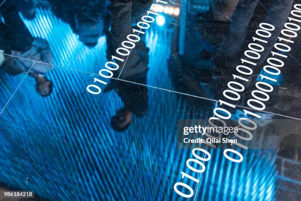 Visitors attend the 2015 Computing Conference in Hangzhou, China, on Wednesday, Oct. 14, 2015. Alibaba Group Holding Ltd.'s bet on data technology is...