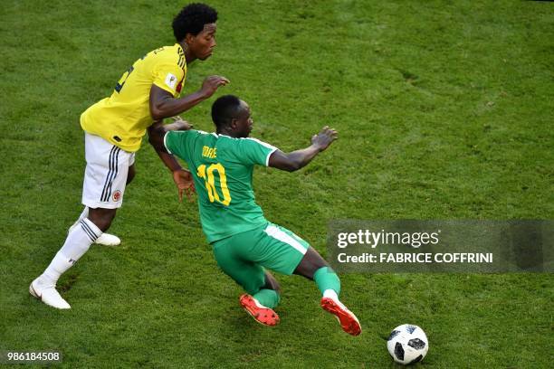 Colombia's midfielder Carlos Sanchez vies for the ball with Senegal's forward Sadio Mane during the Russia 2018 World Cup Group H football match...