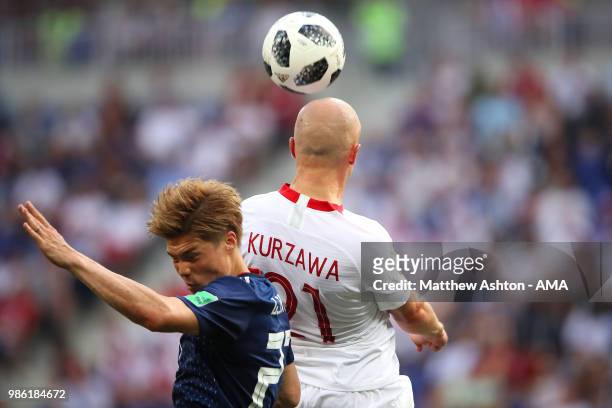 Gotoku Sakai of Japan competes with Rafal Kurzawa of Poland during the 2018 FIFA World Cup Russia group H match between Japan and Poland at Volgograd...