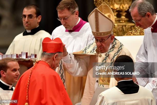 Spanish Luis Francisco Ladaria Ferrer prefect of the Congregation for the Doctrine of the Faith kneels before Pope Francis to pledge allegiance and...