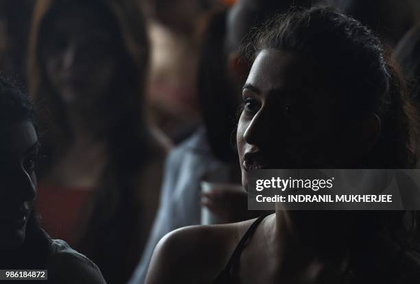 Model interacts with a friend while waiting for the Lakmé Fashion Week Winter/Festive 2018 edition model auditions in Mumbai on June 28, 2018. -...