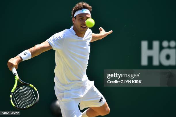 Italy's Marco Cecchinato returns to Australia's John Millman during their men's singles quarter final match at the ATP Nature Valley International...