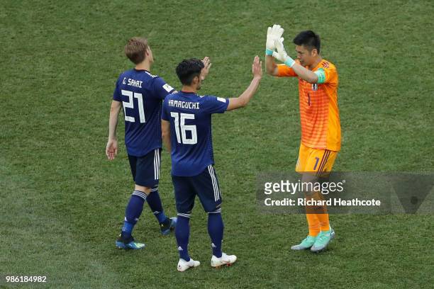 Gotoku Sakai, Hotaru Yamaguchi and Eiji Kawashima of Japan celebrate following the 2018 FIFA World Cup Russia group H match between Japan and Poland...