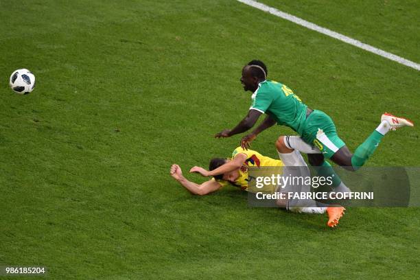 Colombia's defender Santiago Arias vies for the ball with Senegal's forward Sadio Mane during the Russia 2018 World Cup Group H football match...