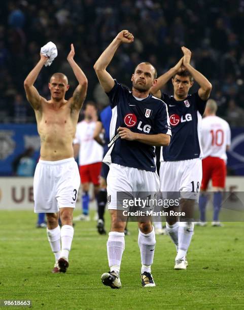 Paul Konchesky, Danny Murphy and Aaron Hughes of Fulham wave to their fans after the UEFA Europa League semi final first leg match between Hamburger...