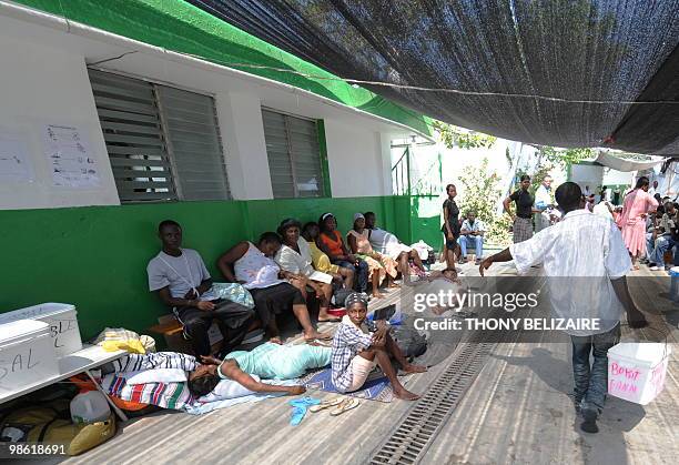 Haitians wait for medical aid at a clinic set up by the Medecins sans Frontieres organization in Cite Soleil on April 22, 2010. MSF is reporting that...