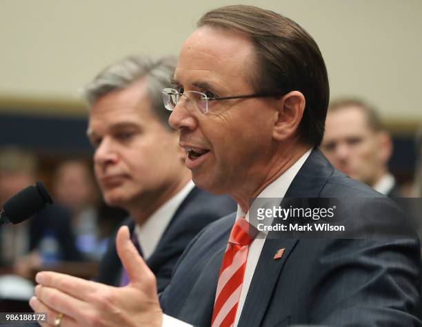Deputy Attorney General Rod Rosenstein and FBI Director Christopher Wray testify during a House Judiciary Committee hearing June 28, 2018 on Capitol...