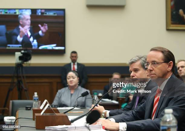 Deputy Attorney General Rod Rosenstein and FBI Director Christopher Wray testify during a House Judiciary Committee hearing June 28, 2018 on Capitol...