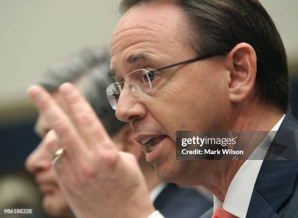 Deputy Attorney General Rod Rosenstein and FBI Director Christopher Wray testify during a House Judiciary Committee hearing June 28, 2018 on Capitol...