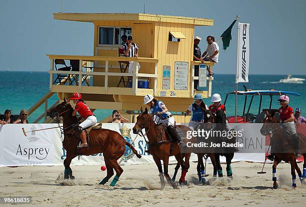 Polo players from the Fiji Water and Grey Goose teams compete at the AMG South Beach Women's Polo Cup on April 22, 2010 in Miami Beach, Florida. The...