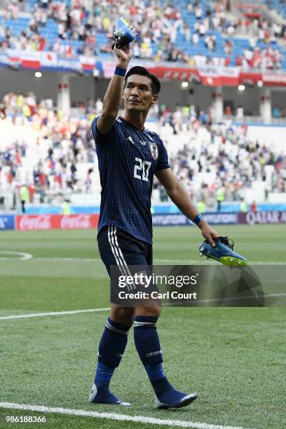 Tomoaki Makino of Japan acknowledges the fans following the 2018 FIFA World Cup Russia group H match between Japan and Poland at Volgograd Arena on...