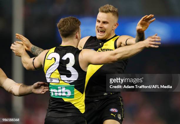Kane Lambert of the Tigers celebrates a goal with Brandon Ellis of the Tigers during the 2018 AFL round 15 match between the Richmond Tigers and the...