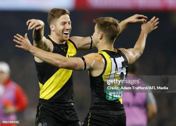 Jayden Short of the Tigers celebrates a goal with Kane Lambert of the Tigers during the 2018 AFL round 15 match between the Richmond Tigers and the...