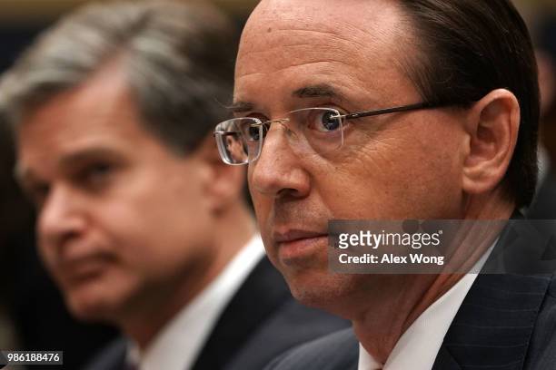 Deputy Attorney General Rod Rosenstein and FBI Director Christopher Wray testify during a hearing before the House Judiciary Committee June 28, 2018...
