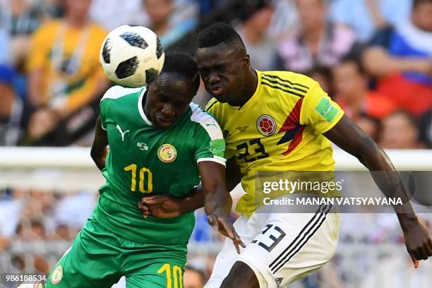 Senegal's forward Sadio Mane heads the ball as he vies for it with Colombia's defender Davinson Sanchez during the Russia 2018 World Cup Group H...