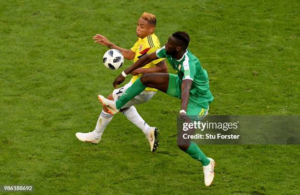 Luis Muriel of Colombia and Salif Sane of Senegal Colombia is tackled by during the 2018 FIFA World Cup Russia group H match between Senegal and...