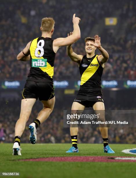 Jack Riewoldt of the Tigers celebrates a goal with Jayden Short of the Tigers during the 2018 AFL round 15 match between the Richmond Tigers and the...