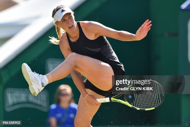 Denmark's Caroline Wozniacki returns through her legs to Australia's Ashleigh Barty during their women's singles quarter final match at the ATP...