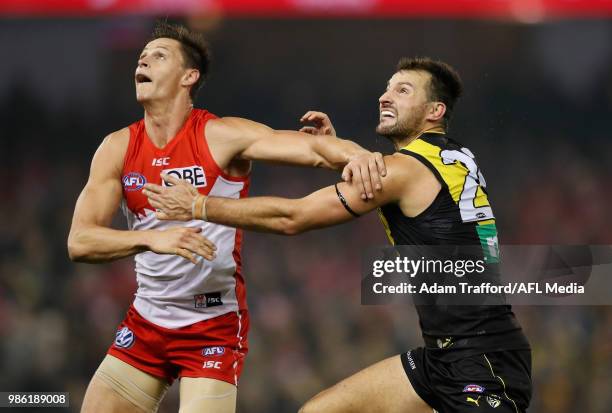 Callum Sinclair of the Swans and Toby Nankervis of the Tigers compete in a ruck contest during the 2018 AFL round 15 match between the Richmond...