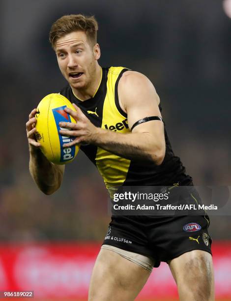 Kane Lambert of the Tigers in action during the 2018 AFL round 15 match between the Richmond Tigers and the Sydney Swans at Etihad Stadium on June...