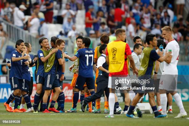 Japan players celebrate following the 2018 FIFA World Cup Russia group H match between Japan and Poland at Volgograd Arena on June 28, 2018 in...