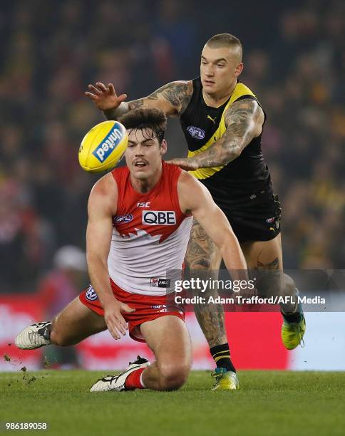 George Hewett of the Swans and Dustin Martin of the Tigers compete for the ball during the 2018 AFL round 15 match between the Richmond Tigers and...