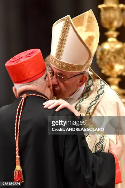Iraqi Louis Raphael I Sako patriarch of Babylon of the Chaldeans kneels before Pope Francis to pledge allegiance and become cardinal during the...