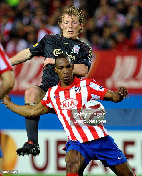 Dirk Kuyt of Liverpool competes with Luis Perea during the UEFA Europa League Semi-Finals First Leg match between Atletico Madrid and Liverpool FC at...