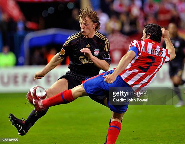 Dirk Kuyt of Liverpool competes with Antonio Lopez of Athletico Madrid during the UEFA Europa League Semi-Finals First Leg match between Atletico...