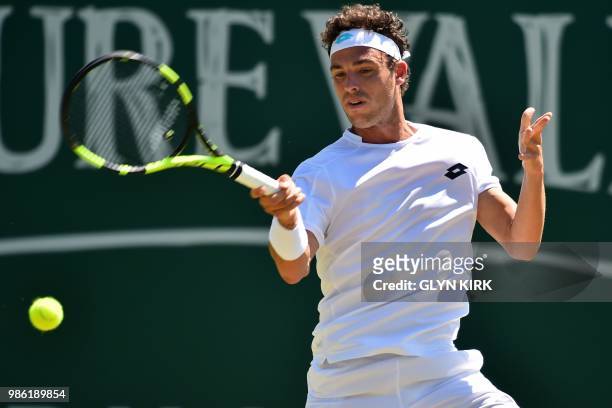 Italy's Marco Cecchinato returns to Australia's John Millman during their men's singles quarter final match at the ATP Nature Valley International...