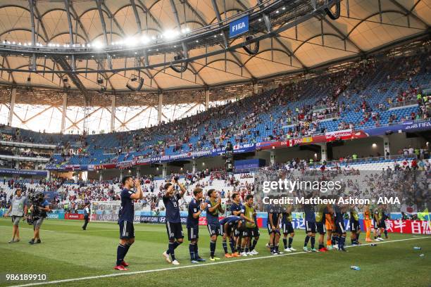 The Japan players acknowledge the fans at the end of the 2018 FIFA World Cup Russia group H match between Japan and Poland at Volgograd Arena on June...