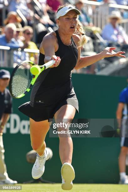 Denmark's Caroline Wozniacki returns to Australia's Ashleigh Barty during their women's singles quarter final match at the ATP Nature Valley...